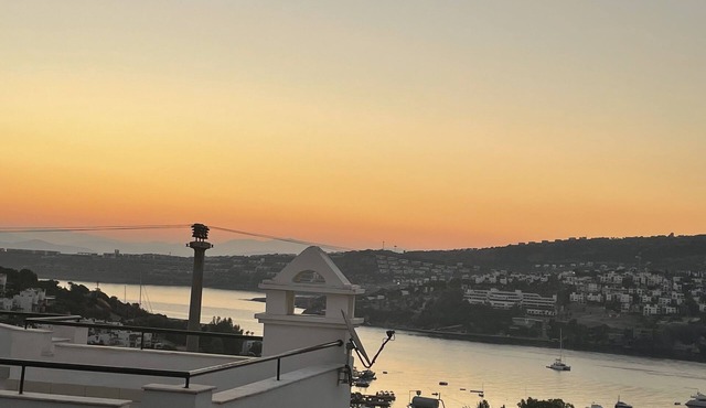 Romantic hillside villa with stunning views, community beach and pool