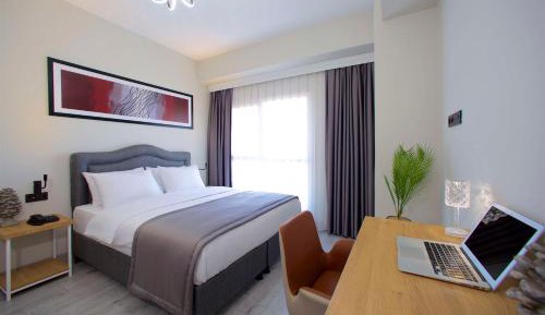 One-Bedroom Apartment with One King and One Single Bed with Sofa Bed and Kitchenette - Non-Smoking