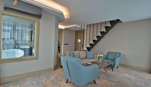Duplex Suite with One Queen Bed and Two Single Beds with Balcony and View